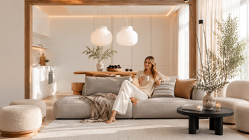 A modern, minimalist, and cozy living room in the morning.